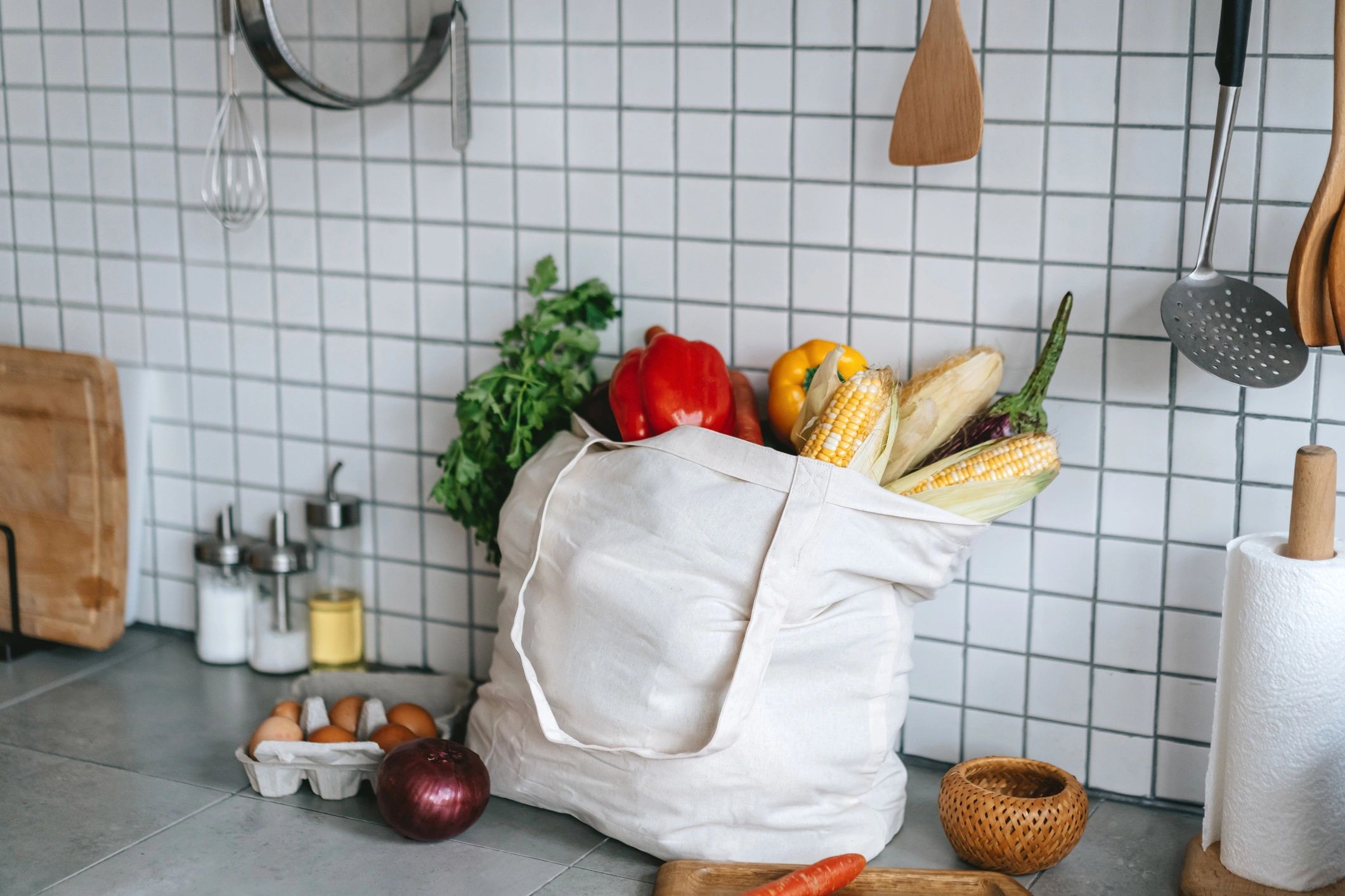 Reusable canvas tote bag with groceries