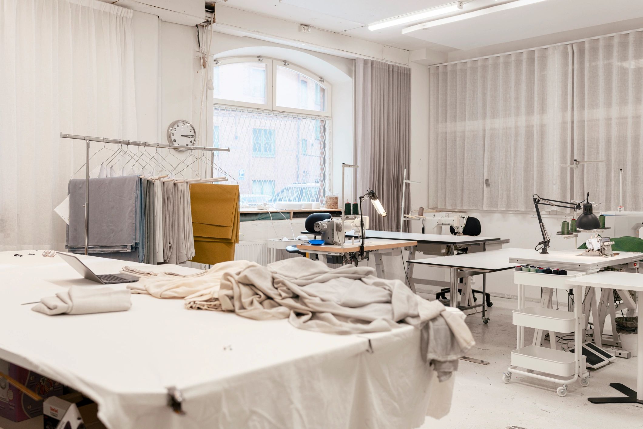 Canvas bag manufacturing workshop with sewing machines and fabric